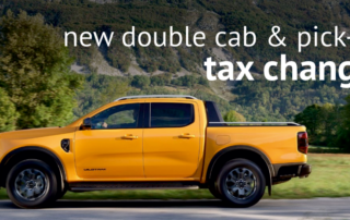 High-resolution image of a yellow double cab pickup truck with the text 'new double cab & pick-up tax change' in bold white font.