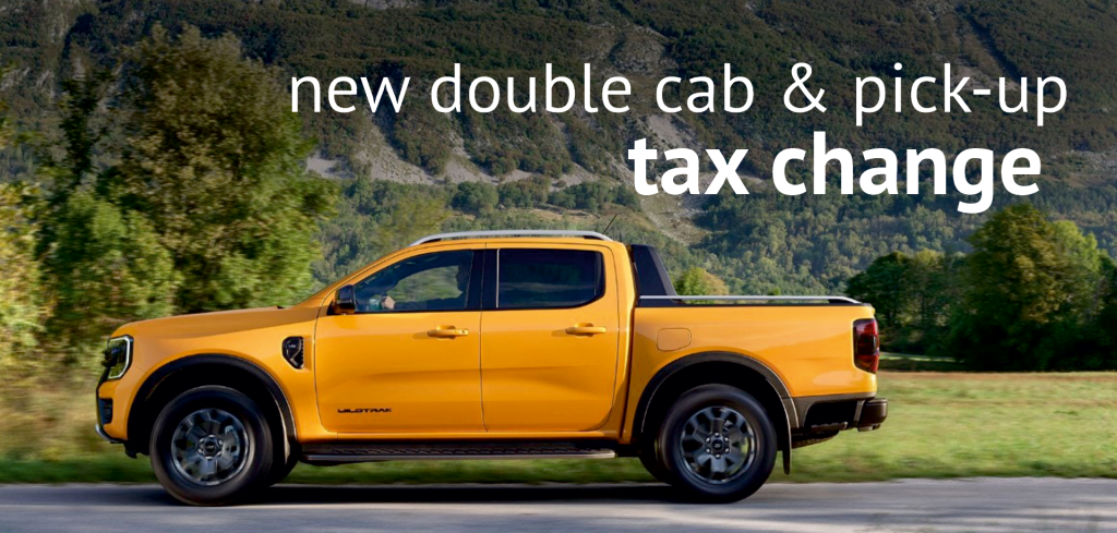 High-resolution image of a yellow double cab pickup truck with the text 'new double cab & pick-up tax change' in bold white font.