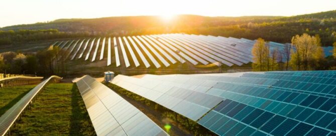 An image with an array of solar panels in a field on a sunny day