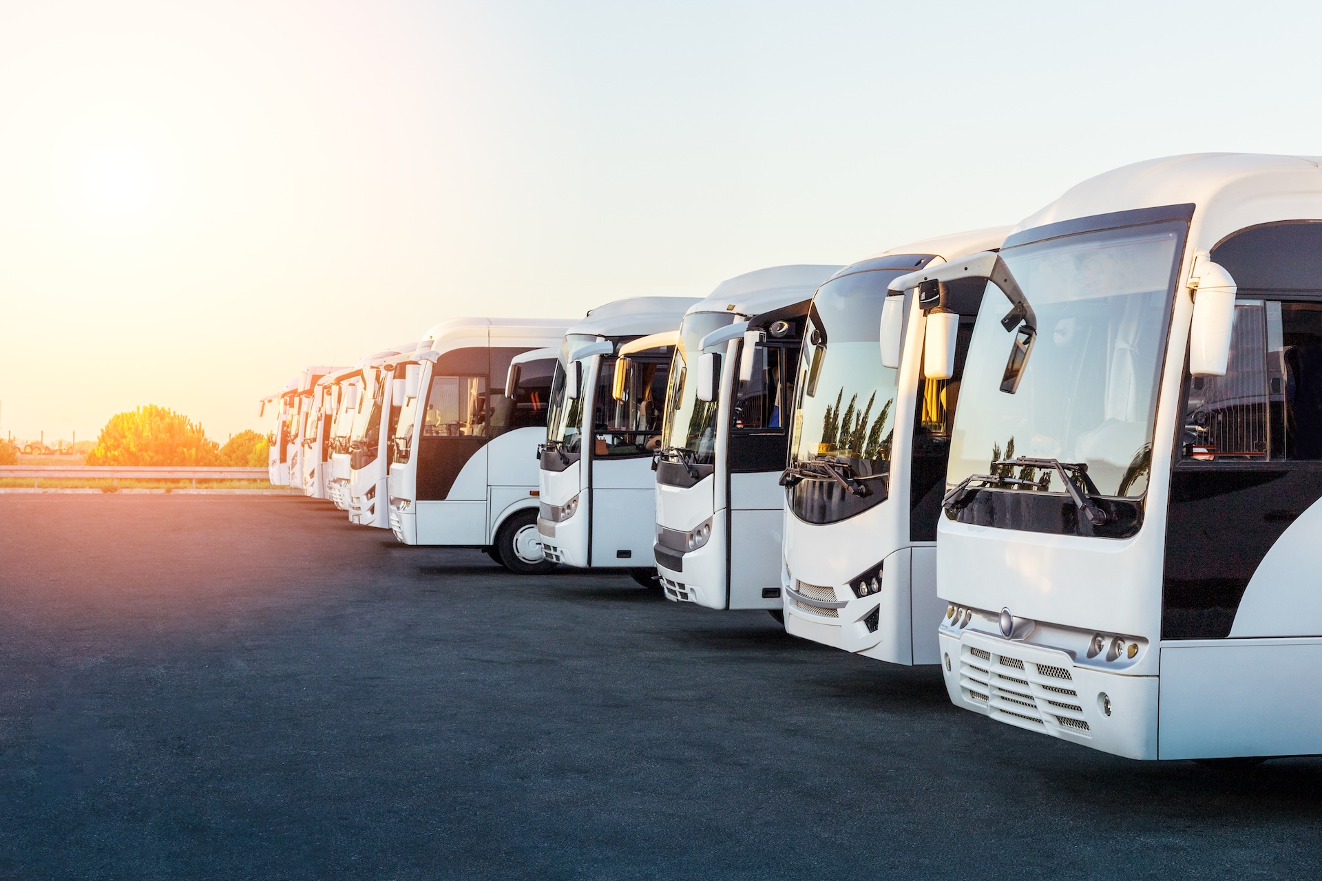 Image of a modern coach buses parked in a lot, representing public transport or coach finance services.