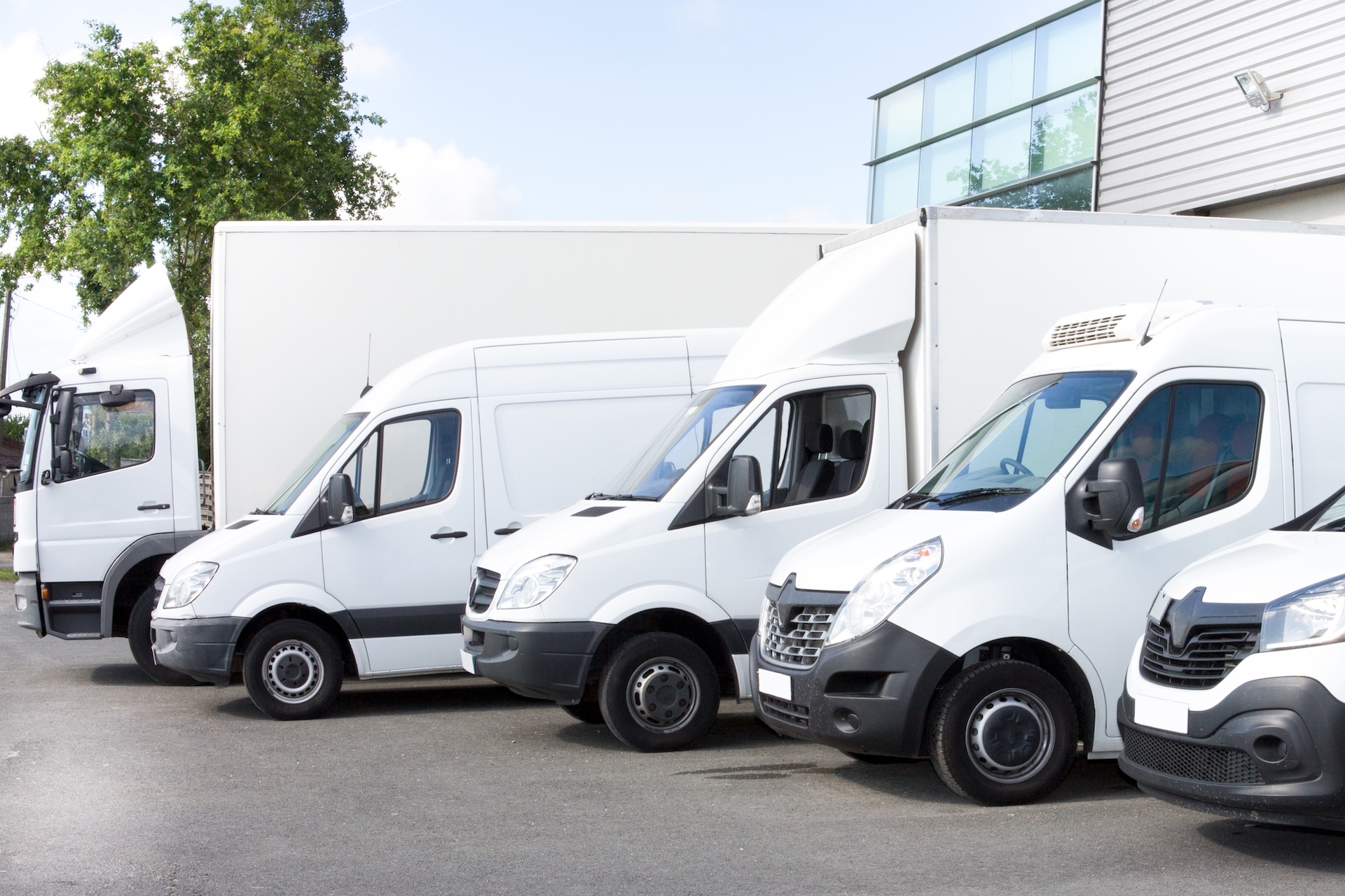 Commercial vehicles parked on a lot, representing finance or leasing for business-related transport solutions.