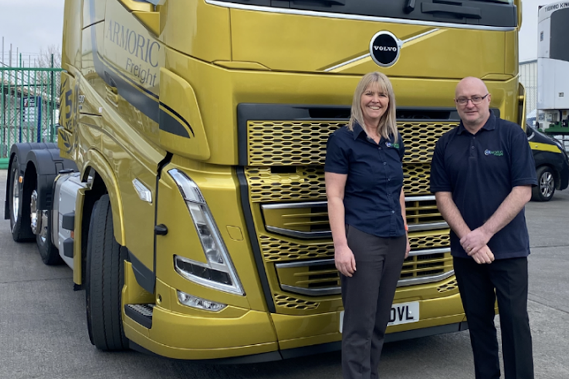 Gold-Volvo-Armoric-Freight-675×1024-copy A man and a woman standing in front of a gold Volvo Armoric Freight truck
